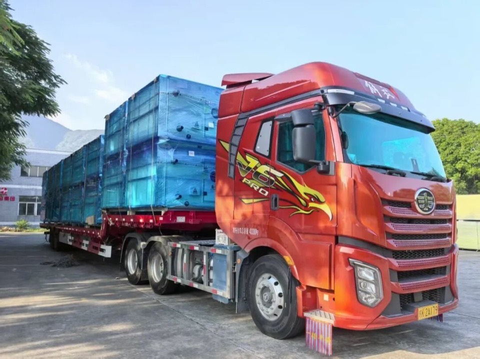 Truck loaded with wrapped Taile air handling units leaving the Taile factory
